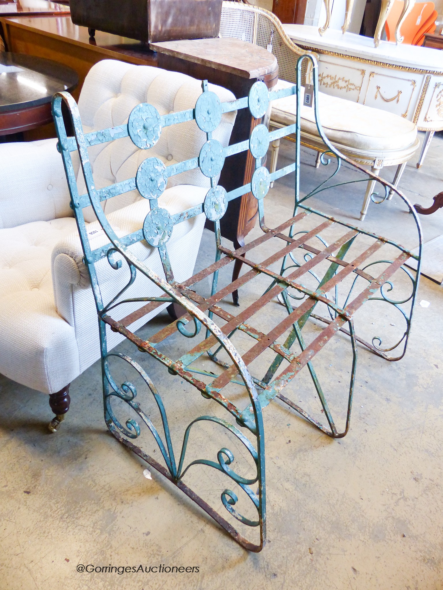 An early 20th century painted wrought iron garden bench, length 90cm, depth 56cm, height 96cm